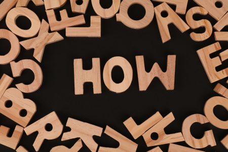 how written on a black background; What Is a Dividend, and How Do Dividend Stocks Work?