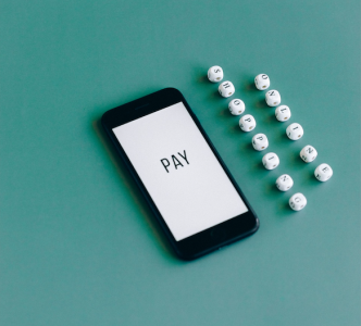 a phone saying pay on it showing online payments; What Is a Payment Gateway Different from a Processor