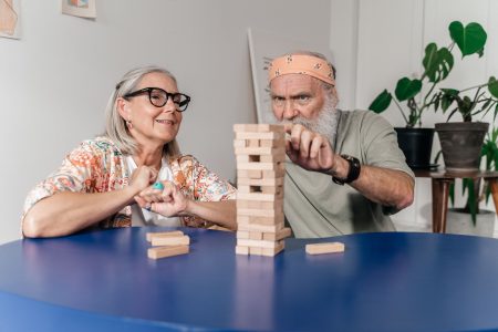 a retired couple with building blocks