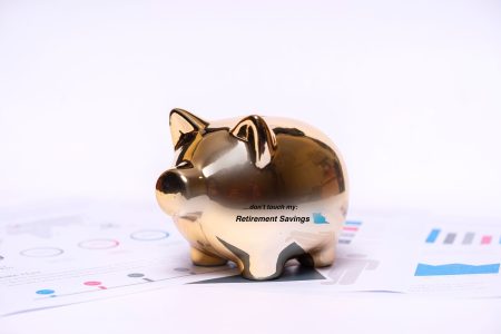 a golden piggybank that says "don't touch my retirement savings."