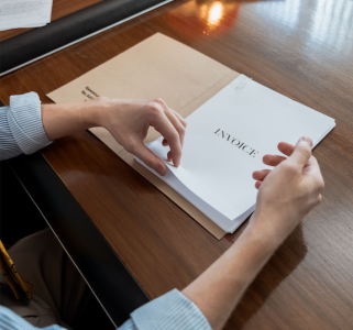 invoice typed on a stack-list of international clients ; Invoice International Clients and Actually Get Paid